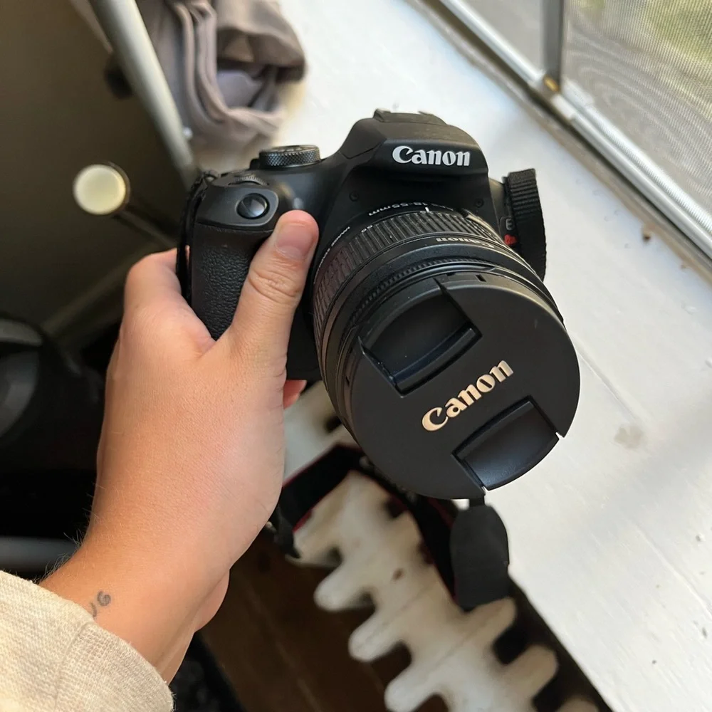 Canon Camera with case, charger, zoom lens and SD card to Apple converter